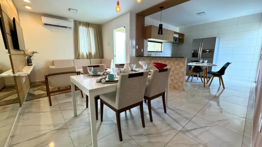 Sala, jantar e cozinha integrados da casa modelo do Bender Ville Pedrinhas; móveis não incluídos